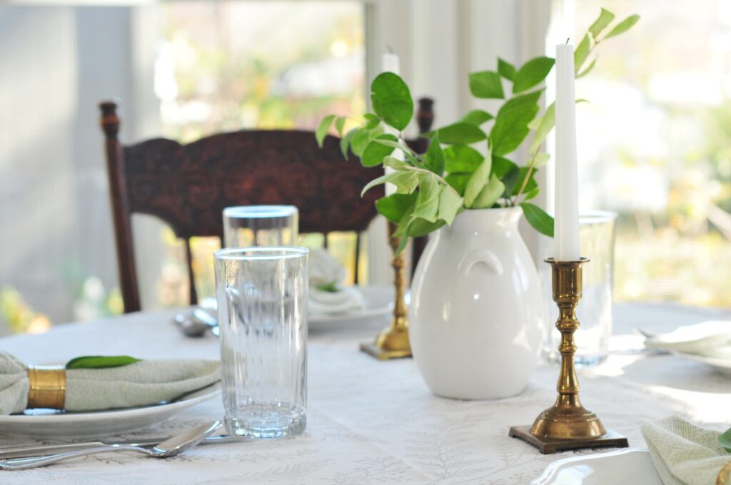 table setting with greenery and candles