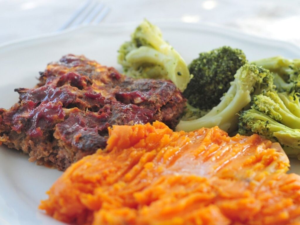 meatloaf, broccoli and sweet potatoes on a plate