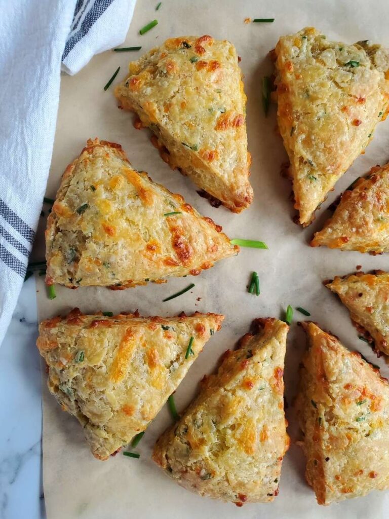 cheddar and chive sourdough scones with chives on parchment paper