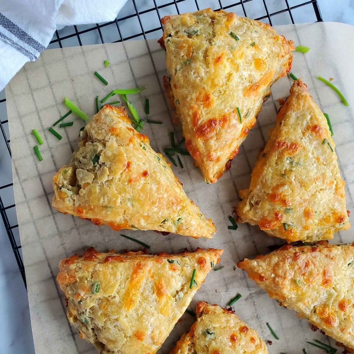 cheddar chive sourdough scones on a cooling rack