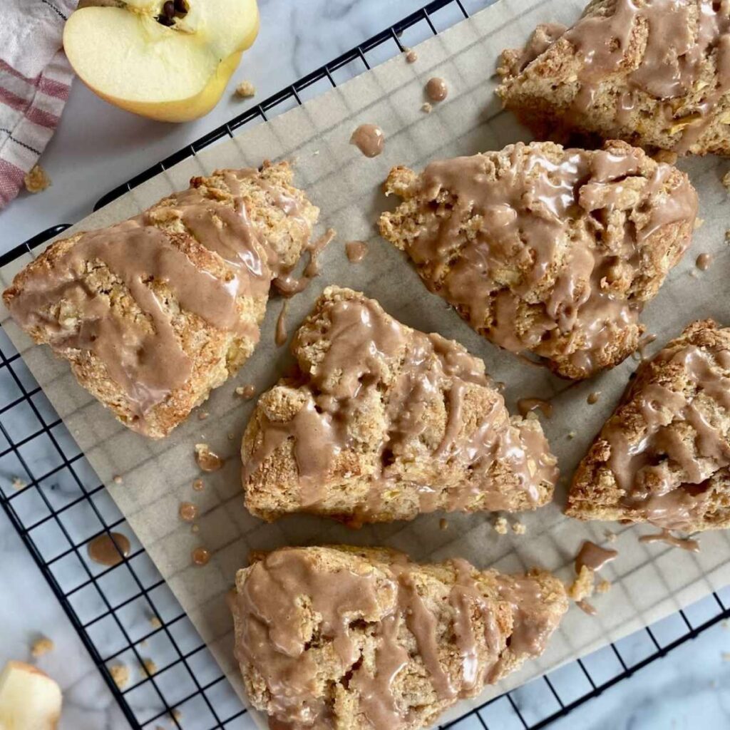 apple cinnamon sourdough scones on a cooling rack