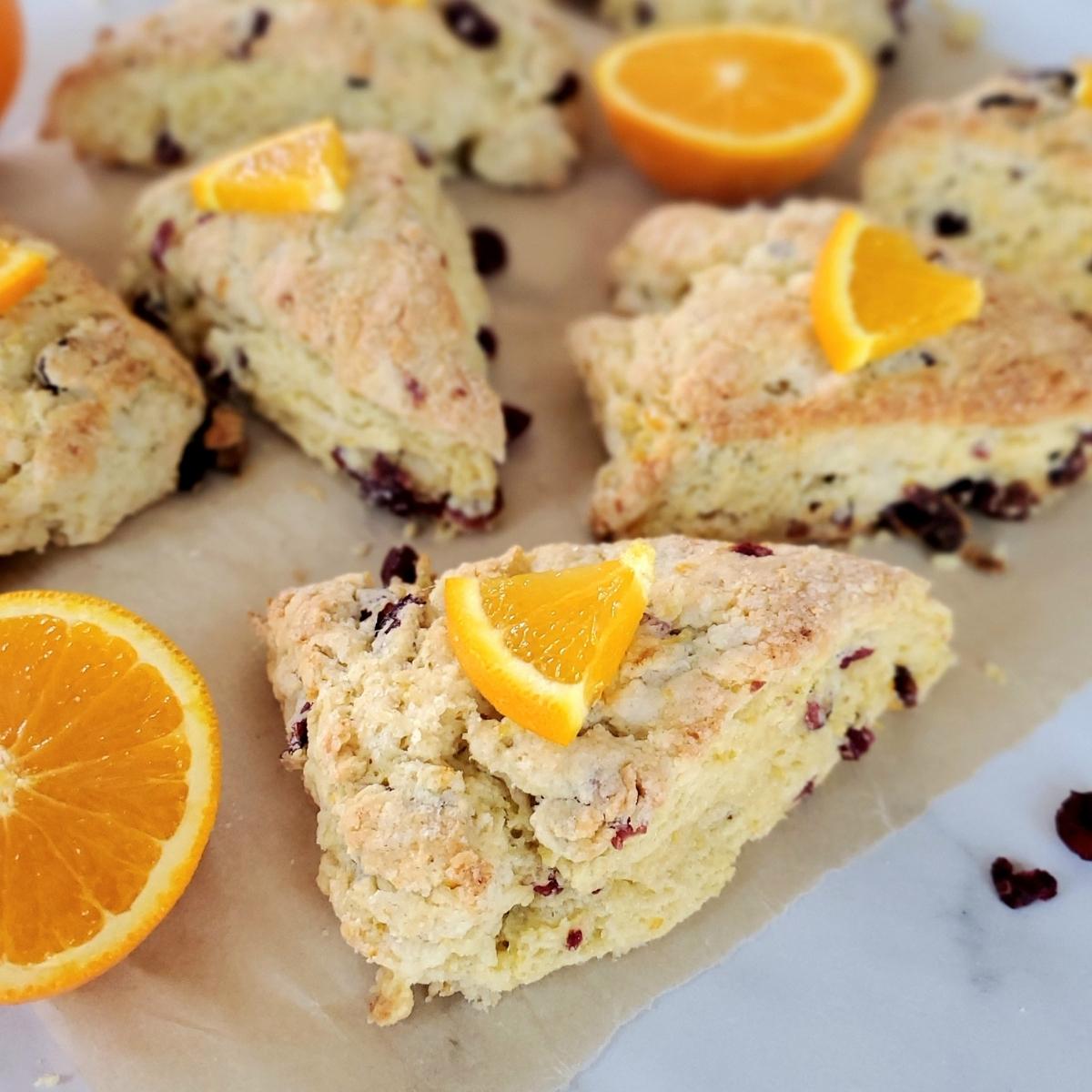 cranberry orange sourdough scones on parchment paper