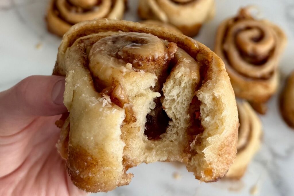 apple pie sourdough cinnamon roll with a bite