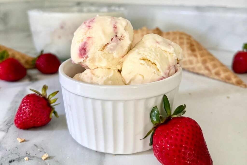 strawberry cheesecake ice cream in a bowl