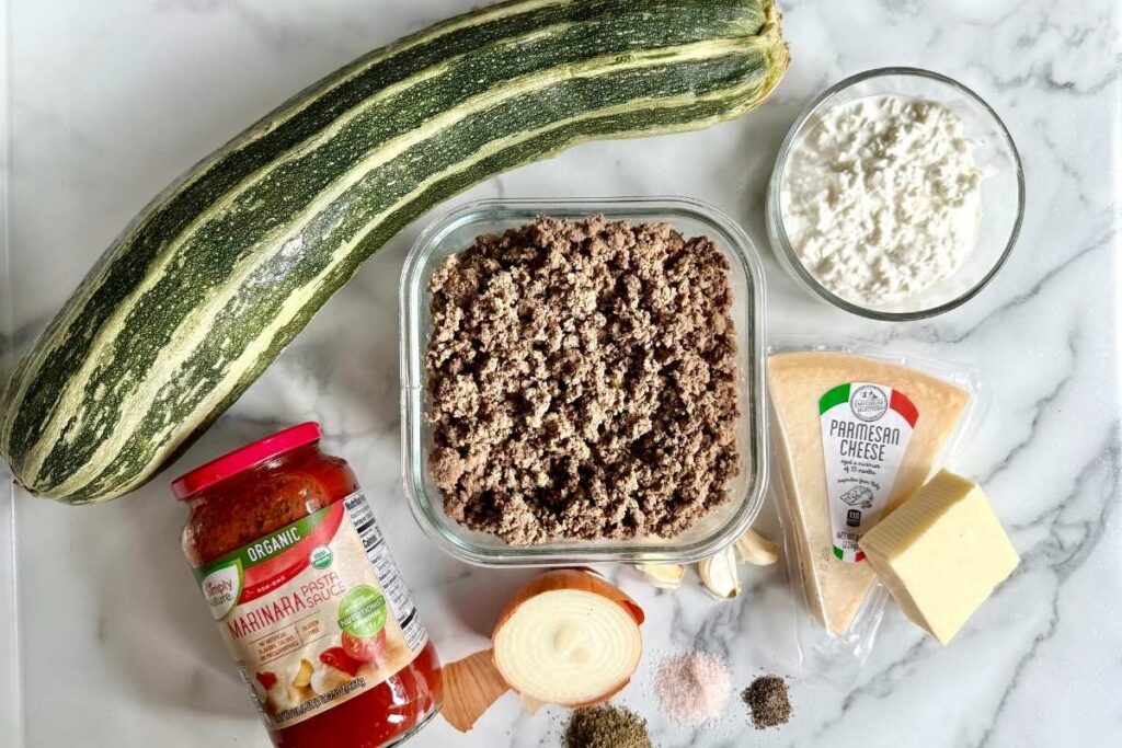 zucchini squash and ground beef on a counter