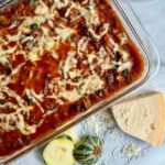 deconstructed zucchini lasagna in a baking dish with parmesan