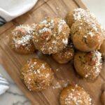 fresh milled sourdough garlic knots on a wood cutting board