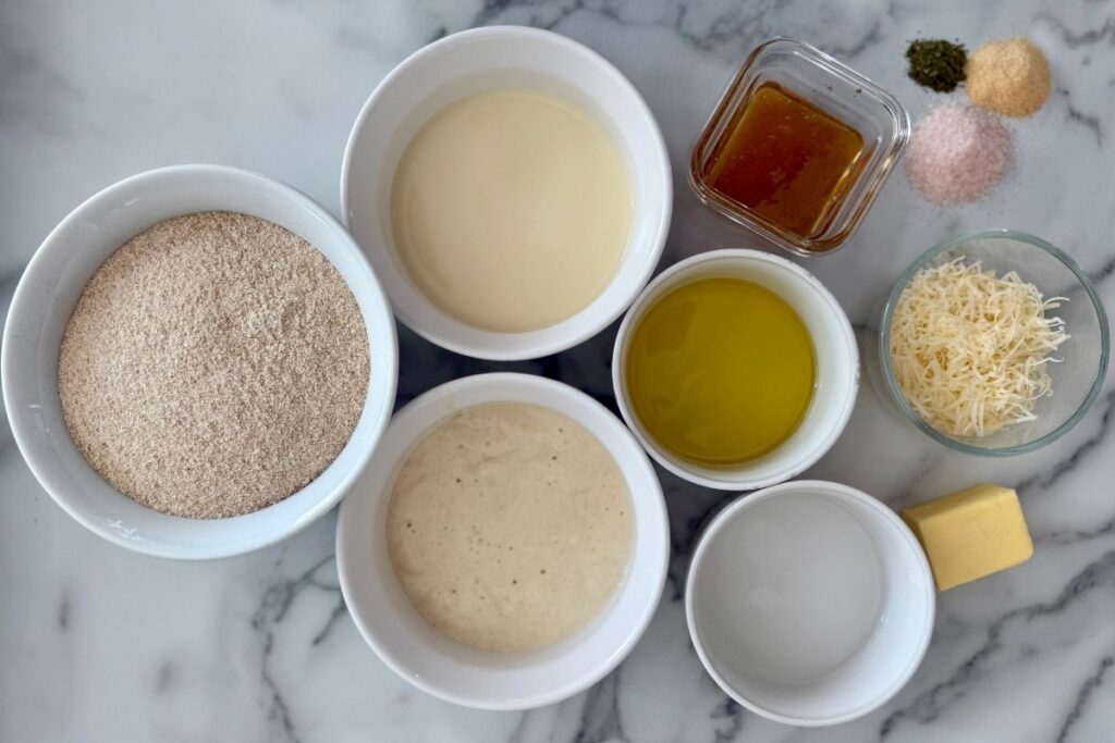 bowl of fresh milled flour and bowl of sourdough starter
