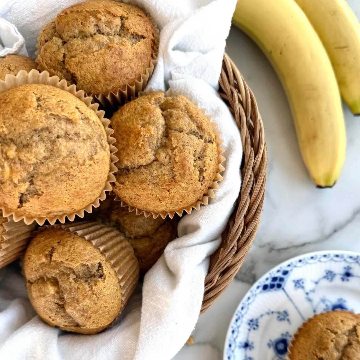 fresh milled einkorn banana muffins in a basket