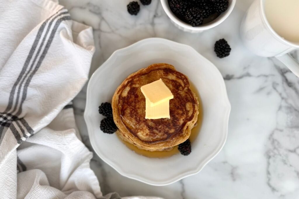 fresh milled einkorn buttermilk pancakes with butter on a plate